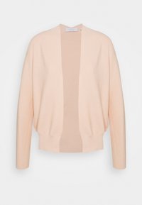 Ljust persikofärgad kofta med öppen framsida, långa ärmar och ribbad nederkant; tillverkad av mjukt stickat material med en jämn yta och lätt design.