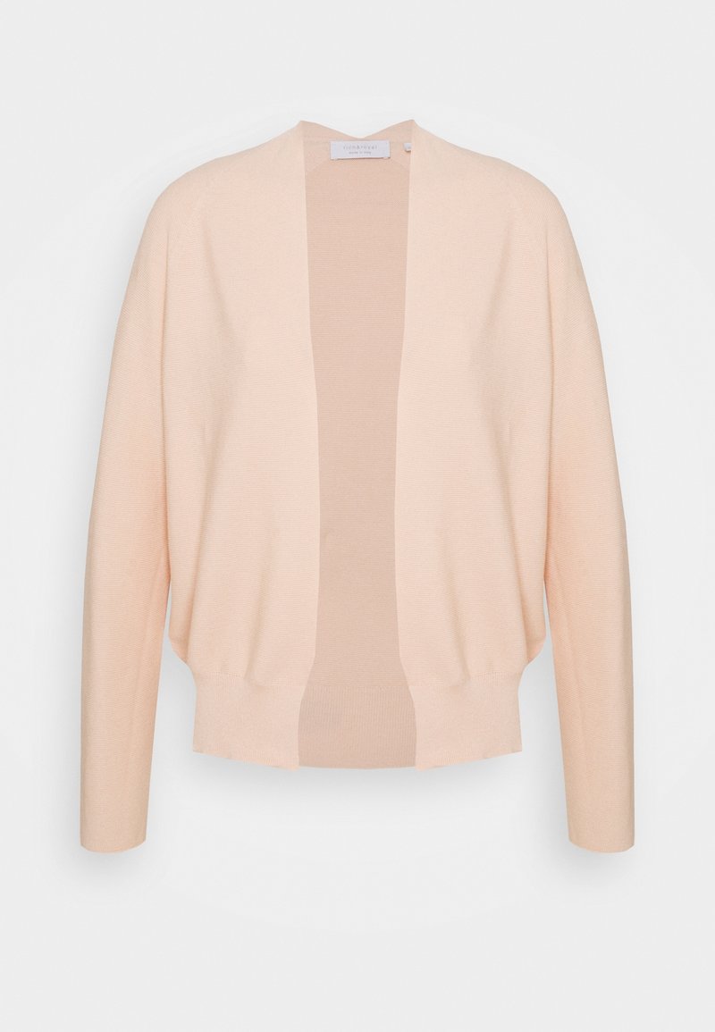 Ljust persikofärgad kofta med öppen framsida, långa ärmar och ribbad nederkant; tillverkad av mjukt stickat material med en jämn yta och lätt design.