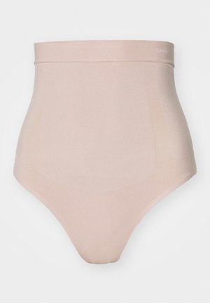 Calvin Klein høy midje truse i lys beige med en glatt tekstur, sømløst design og en subtil logo på livet.