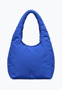 Niebieska torba na ramię z wypełnieniem, o zaokrąglonym, wydłużonym kształcie, z jednym uchwytem i wytłoczonym logo "GOT BAG" na dolnym froncie. Gładka tekstura.
