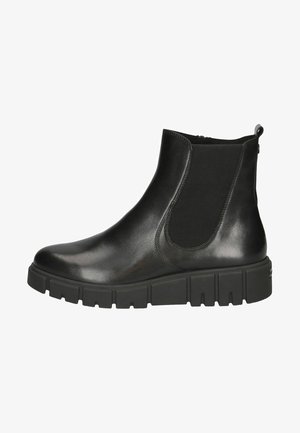 Schwarze Lederknöchelstiefel mit elastischen Seiteneinsätzen, runder Zehenform und einer klobigen, strukturierten Gummisohle. Mit einer Zuglasche an der Rückseite.