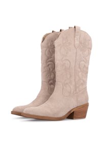Botas de cowboy de ante beige con bordado floral, punta afilada y tacón de madera apilada, con lengüetas laterales para facilitar el calzado.