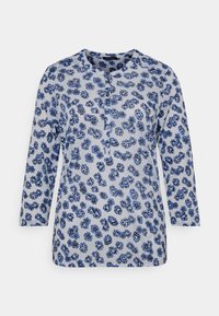Blue floral print long-sleeve top with a round neckline and button placket. Soft fabric with a light background and textured pattern.