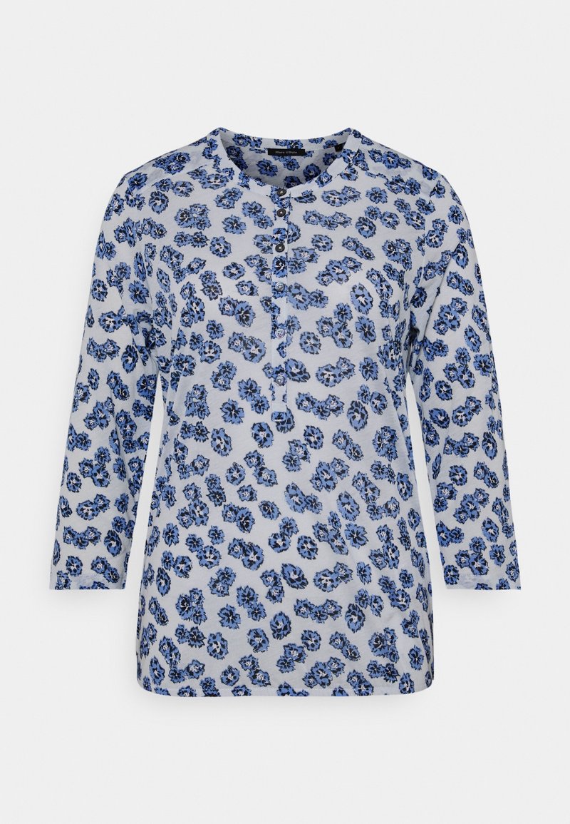 Blue floral print long-sleeve top with a round neckline and button placket. Soft fabric with a light background and textured pattern.