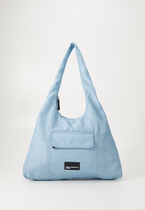 Light blue nylon shoulder bag with a curved, elongated shape, featuring a front pocket and a zipper closure at the top.