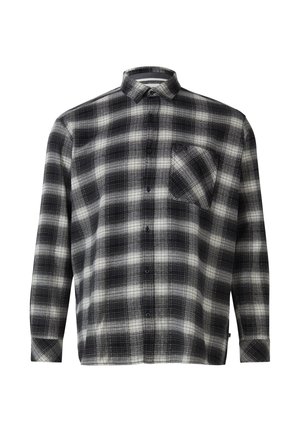 Chemise à carreaux noir et blanc, manches longues, une poche poitrine, en tissu texturé avec col pointu et ourlet arrondi.