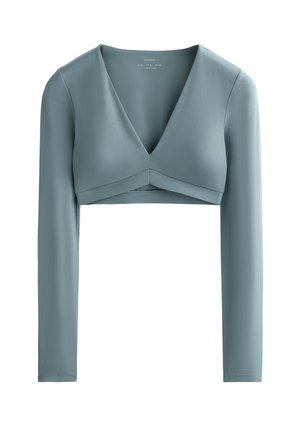 Svijetloplava skraćena majica dugih rukava s dubokim V-izrezom i prekriženim prednjim dizajnom, izrađena od glatke, rastezljive tkanine.