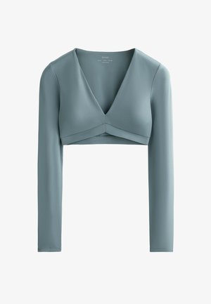 Light blue cropped long-sleeve top with a deep V-neckline and crossover front design, made from a smooth, stretchy fabric.