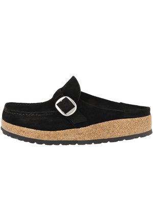 Black suede clog with adjustable buckle, cork platform, textured rubber sole, and stitching details along the edges.