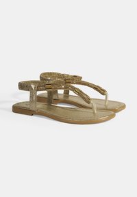 Goldene metallische Flatsandalen mit strukturierten Riemen, einer gepolsterten Innensohle und klaren Akzenten an dem Zehensteg.