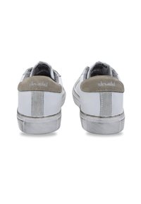 White sneakers with grey suede heel tabs, textile accents, and rubber soles. Features smooth leather, subtle stitching, and ventilation holes.
