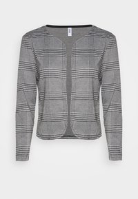 Veste pour femme à carreaux noir et blanc avec une coupe ajustée, manches longues et encolure arrondie. Tissu lisse avec des accents gris contrastants.