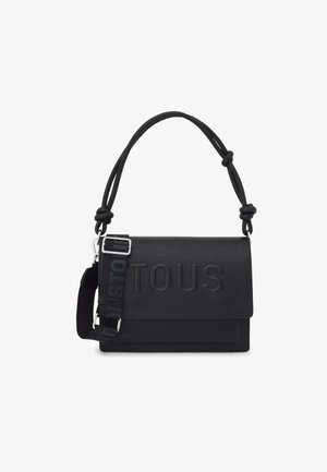 Sac messager en cuir noir avec logo "TOUS" embossé, doté d'une anse supérieure nouée détachable et d'une sangle réglable avec détail de logo.