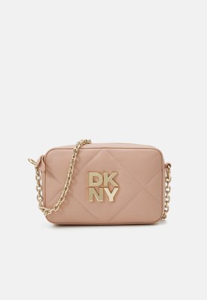 Quilted pink faux leather crossbody bag featuring a gold-chain strap and bold DKNY logo in gold. Rectangular shape with smooth texture.