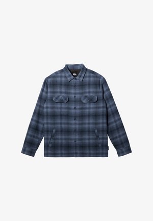 Blue plaid button-up shirt made of soft fabric, featuring two chest pockets, a collared neckline, and a straight-cut hem.