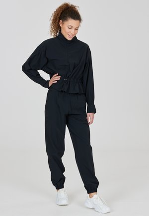 Athlecia, ATHLECIA PANTS HERO - Stoffhose - black