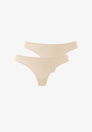 Ensemble de string nude sans couture avec une texture lisse, une taille douce et un design à couverture minimale. Deux pièces incluses.