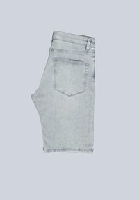 Light blue denim shorts with a five-pocket design, featuring a single back pocket and a raw hem. The fabric has a soft texture.