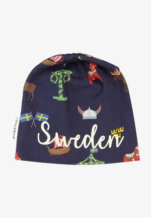 Navy fabric beanie featuring colorful Swedish icons, including flags, a tree, a moose, and traditional motifs, with "Sweden" in white text.