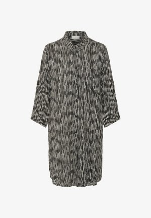 Chemise boutonnée à rayures noires et blanches, avec col, manches trois-quarts et une poche avant. Coupe décontractée et tissu léger.