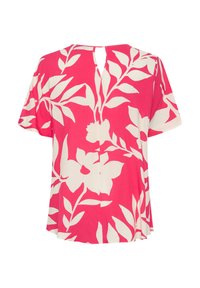 Blusa rosa a maniche corte con motivo floreale bianco, texture liscia, dettaglio sulla schiena con apertura a chiave e orlo dritto.