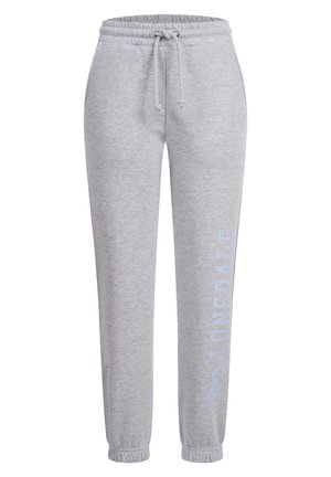 Grey sweatpants made of soft fabric, featuring an elastic waistband with drawstring, tapered cuffs, and a logo print on the left leg.