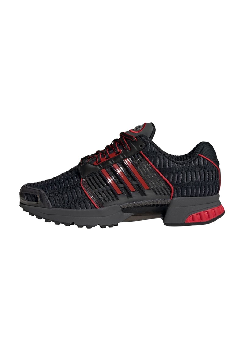 Black and red athletic shoes with a mesh upper, reflective accents, and rubber outsole. Features a padded collar and lace-up design.