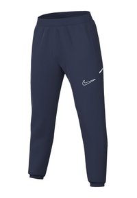 Pantaloni da tuta Nike blu navy con vestibilità affusolata, vita elastica, tasche laterali e dettagli bianchi del logo sulla coscia sinistra e sull'orlo.