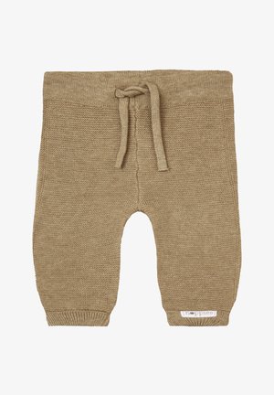 Pantalon pour bébé en tricot beige avec une finition texturée, des poignets côtelés et une taille à cordon de serrage. Présente une petite étiquette sur le côté.