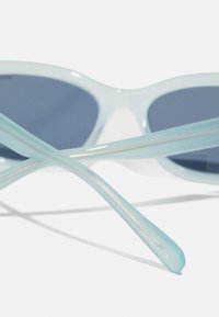 Swarovski Akiniai nuo saulės - milky light blue/polar dark blue