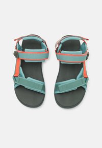 Two sandals with a dark sole, featuring light blue and orange straps, adjustable buckles, flat design, and textured footbed.
