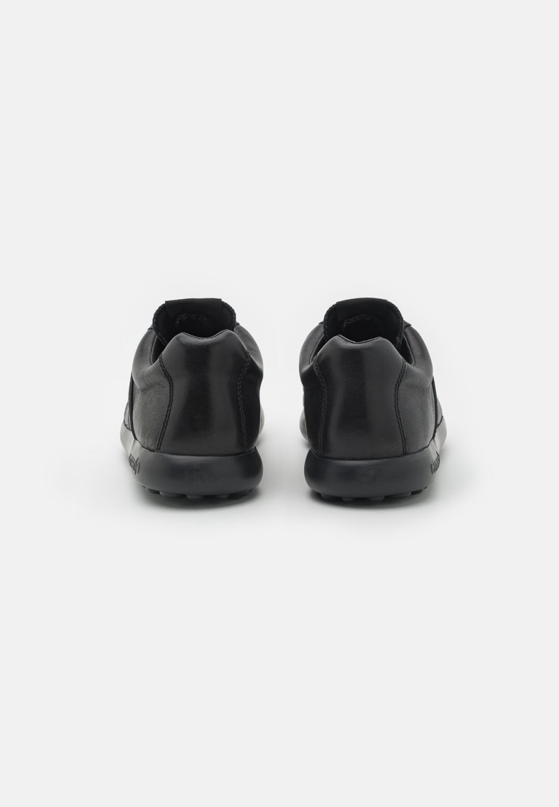 Black leather shoes with a smooth texture, low-profile design, rounded heels, and an elasticated entry for easy wear.