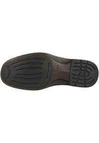 Black rubber outsole with tread pattern, showing ridges and grooves for traction. Brown midsole detail, with "Josef Seibel" embossed.