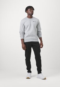Champion ICONS HEM PANTS - Treniņtērpa apakšdaļas - black