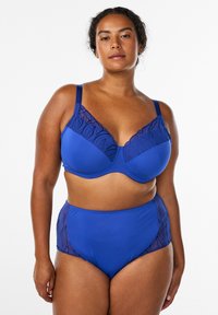 Blue bra and high-waisted panties feature a smooth, solid texture with lace accents on the cups and sides, showcasing a leaf pattern.