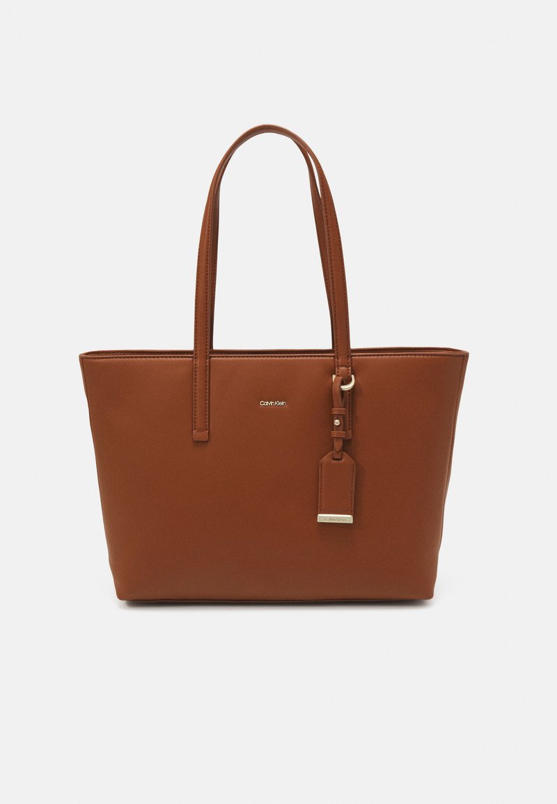 Calvin klein tan handbag Clearance