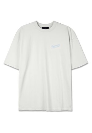 Light grey oversized cotton t-shirt with a crew neckline and short sleeves. Features a small blue graphic logo on the left chest.