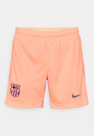 Hellorange Sportshorts aus strukturiertem Material. Mit dem Wappen von Barcelona und einem dunkelblauen Nike-Logo auf der unteren rechten Seite.