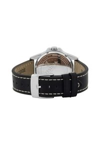 Bracelet en cuir noir avec coutures blanches, boîtier en acier inoxydable argenté et fond de boîtier transparent montrant les détails d'étanchéité.