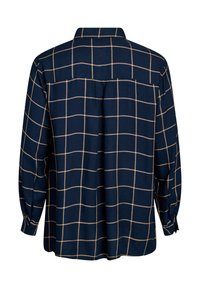 Navy blouse with a beige grid pattern, long sleeves, button-up collar, and relaxed fit. Smooth fabric with a subtle sheen.