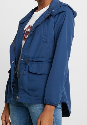 Marineblauer Windbreaker-Jacke mit Kapuze, Reißverschluss vorne, Kordelzug in der Taille und Seitentaschen. Glattes Material mit entspanntem Schnitt.