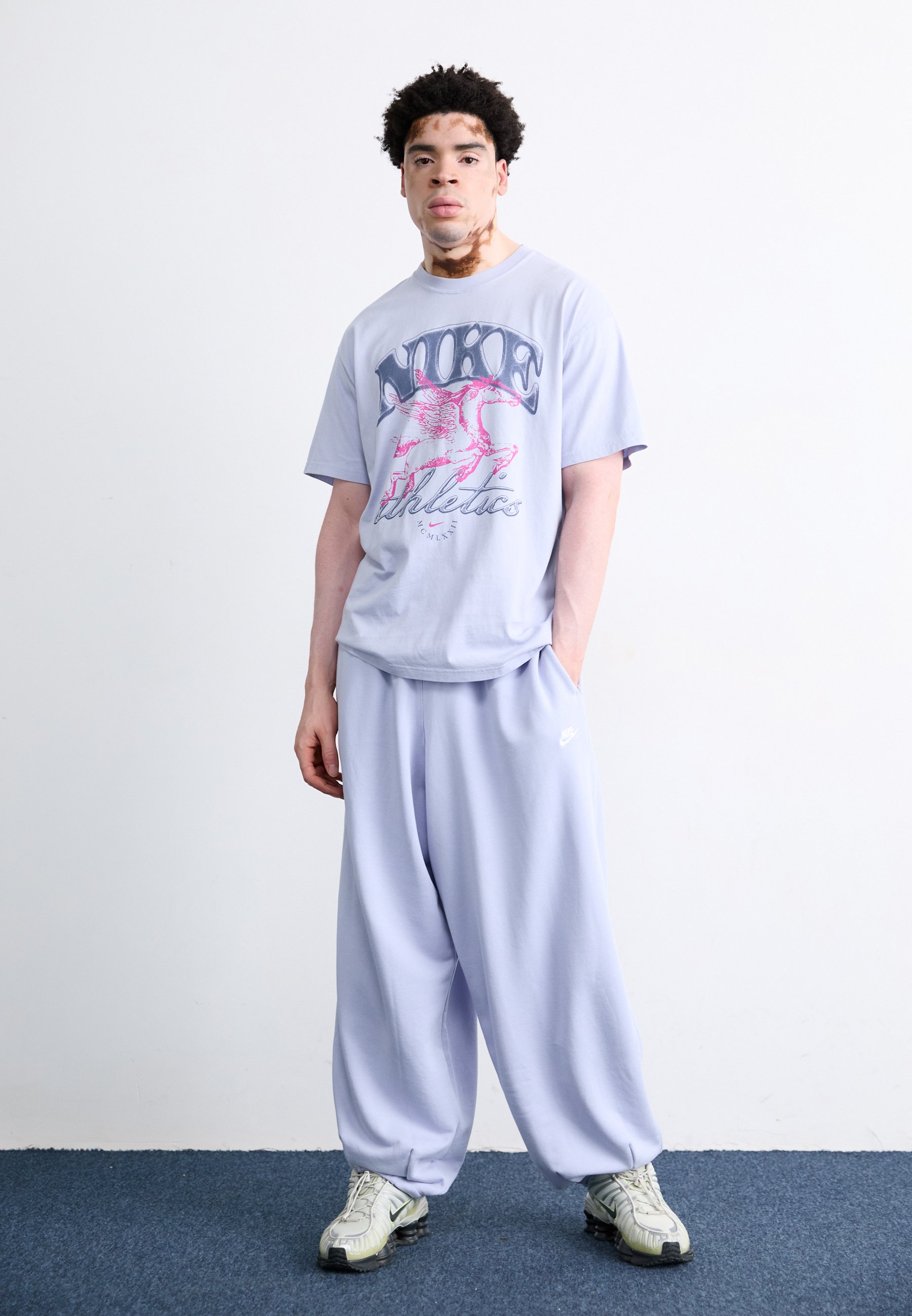 nike graphic fleece tracksuit