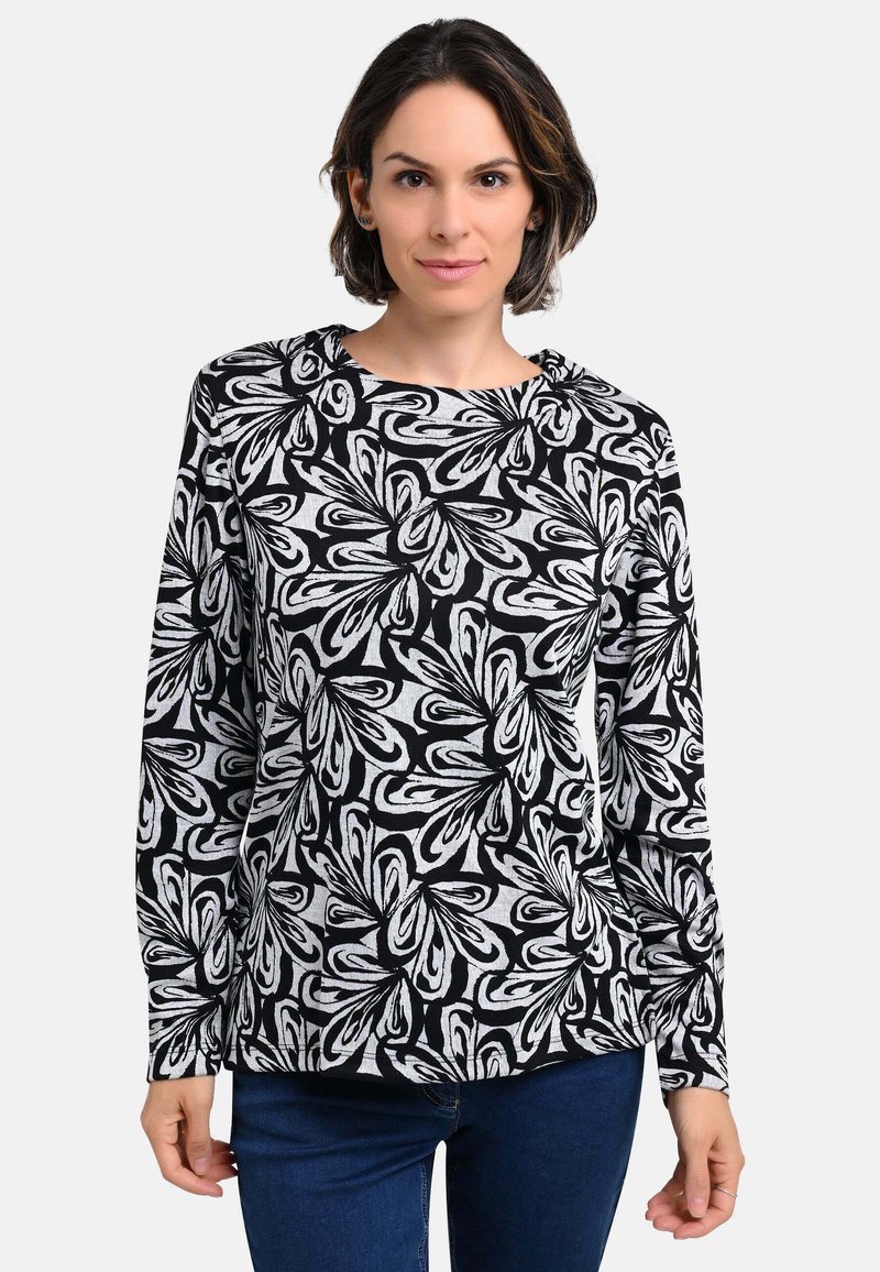 Langärmliges Oberteil mit schwarzem und weißem Blumendruck, aus weichem Stoff gefertigt. Verfügt über einen runden Ausschnitt und eine lässige Passform.