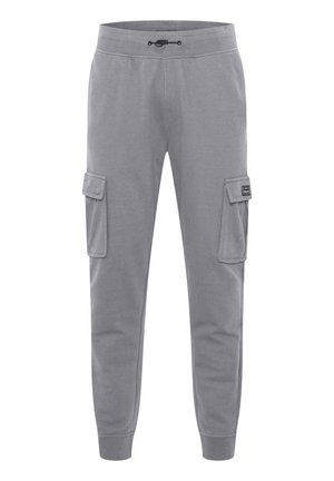 Pantaloni cargo grigi realizzati in tessuto misto cotone, con vita elasticizzata e cordino, due tasche laterali e polsini a costine.