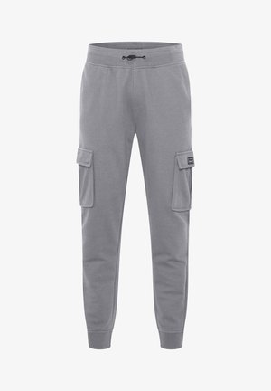 Halli cargo püksid, mis on valmistatud puuvilla segust, sisaldavad elastset vöökohta koos paelaga, kaht küljetaskut ja soonikuid.