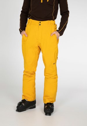 Gelbe Skihose mit geradem Schnitt, ausgestattet mit zwei Seitentaschen, Gürtelschlaufen und Logodetail am Unterschenkel. Glattes, strapazierfähiges Material.