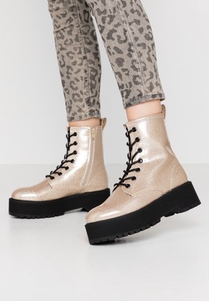 Enkellaarsjes met plateauzool - gold-coloured