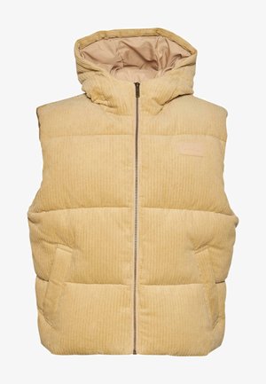 Kollane puuvillane puffer-vest koos kapuutsiga, millel on ees lukuga sulgemine, küljetaskud ja tikandite, tekstuuriga muster.