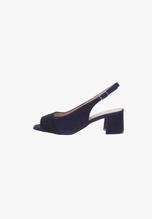 Sandalia slingback de ante azul marino con tacón bloque y punta abierta adornada con pequeñas cuentas decorativas.