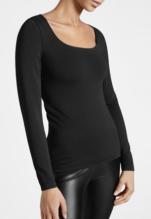 Zwarte longsleeve top met een ronde halslijn, gemaakt van gladde, elastische stof. Getailleerd ontwerp, gecombineerd met zwarte glanzende leggings.